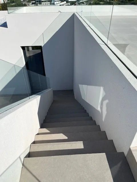 External staircase between white walls at Porto de Mós, Lagos