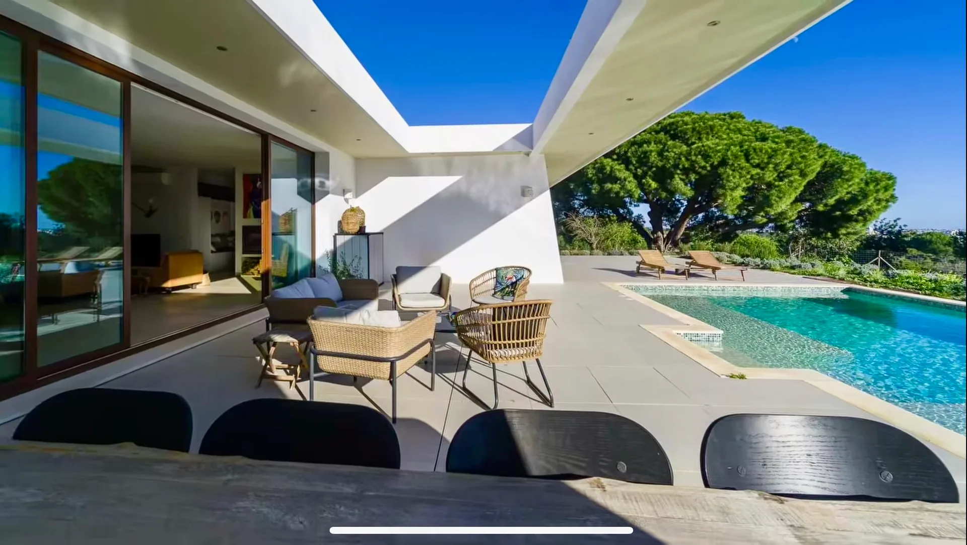 Outdoor dining terrace alongside the Villa Porches pool