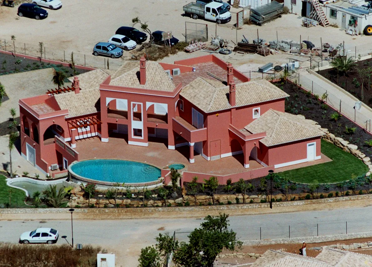 Aerial view of the villa, curved pool and boundary at Quinta do Monte Funchal, Lagos