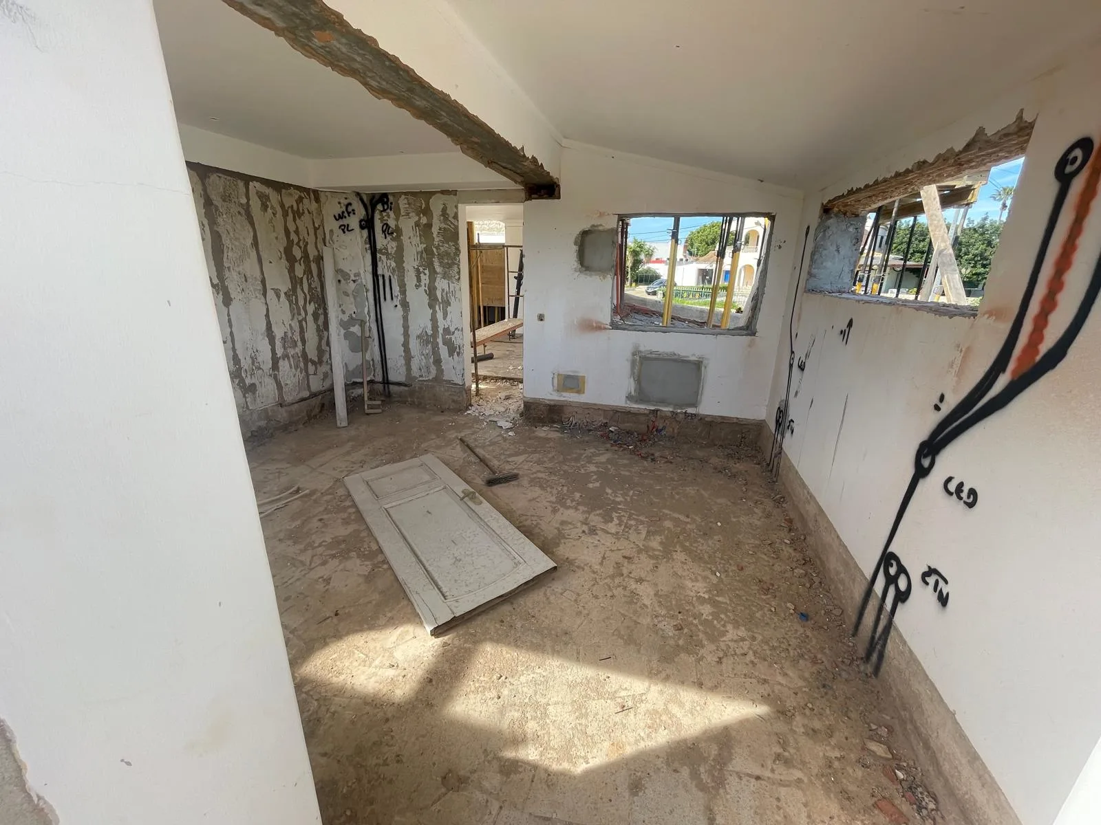 Stripped interior with exposed walls during the Vale Centeanes remodel, Carvoeiro