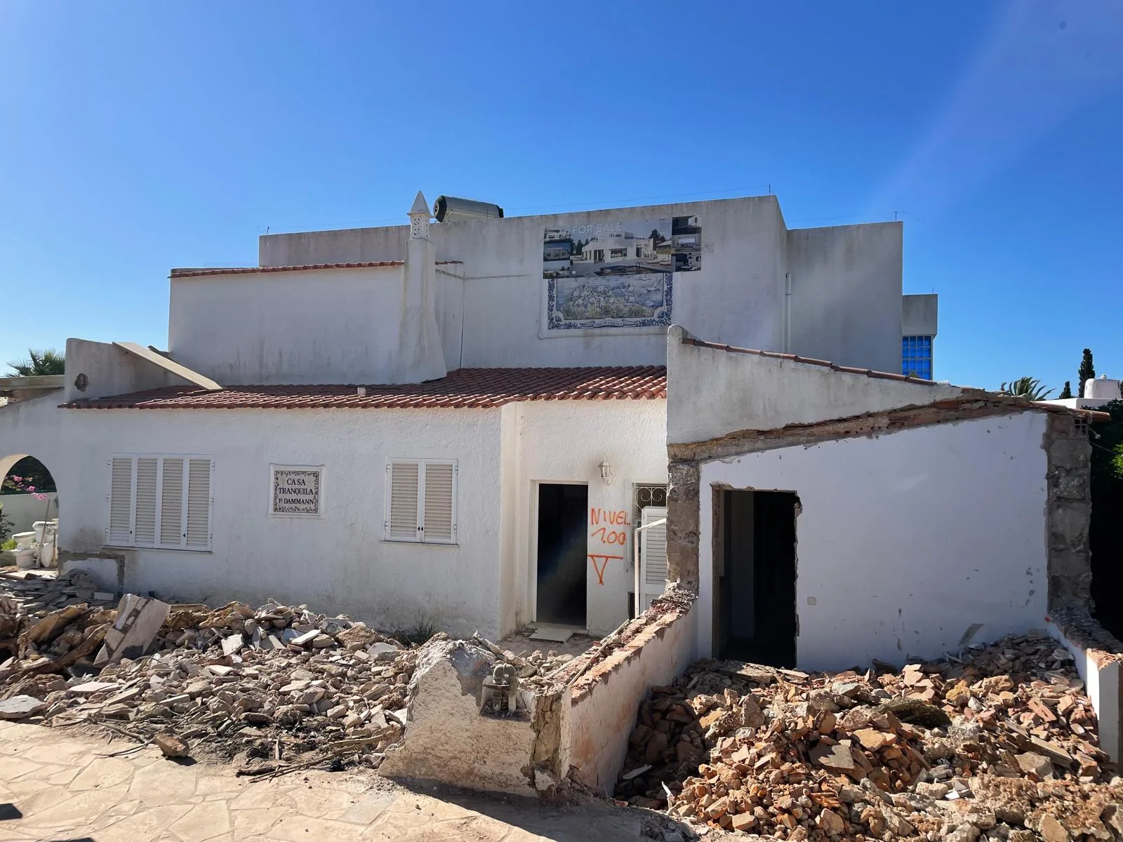 Partially demolished exterior and rubble at Vale Centeanes, Carvoeiro