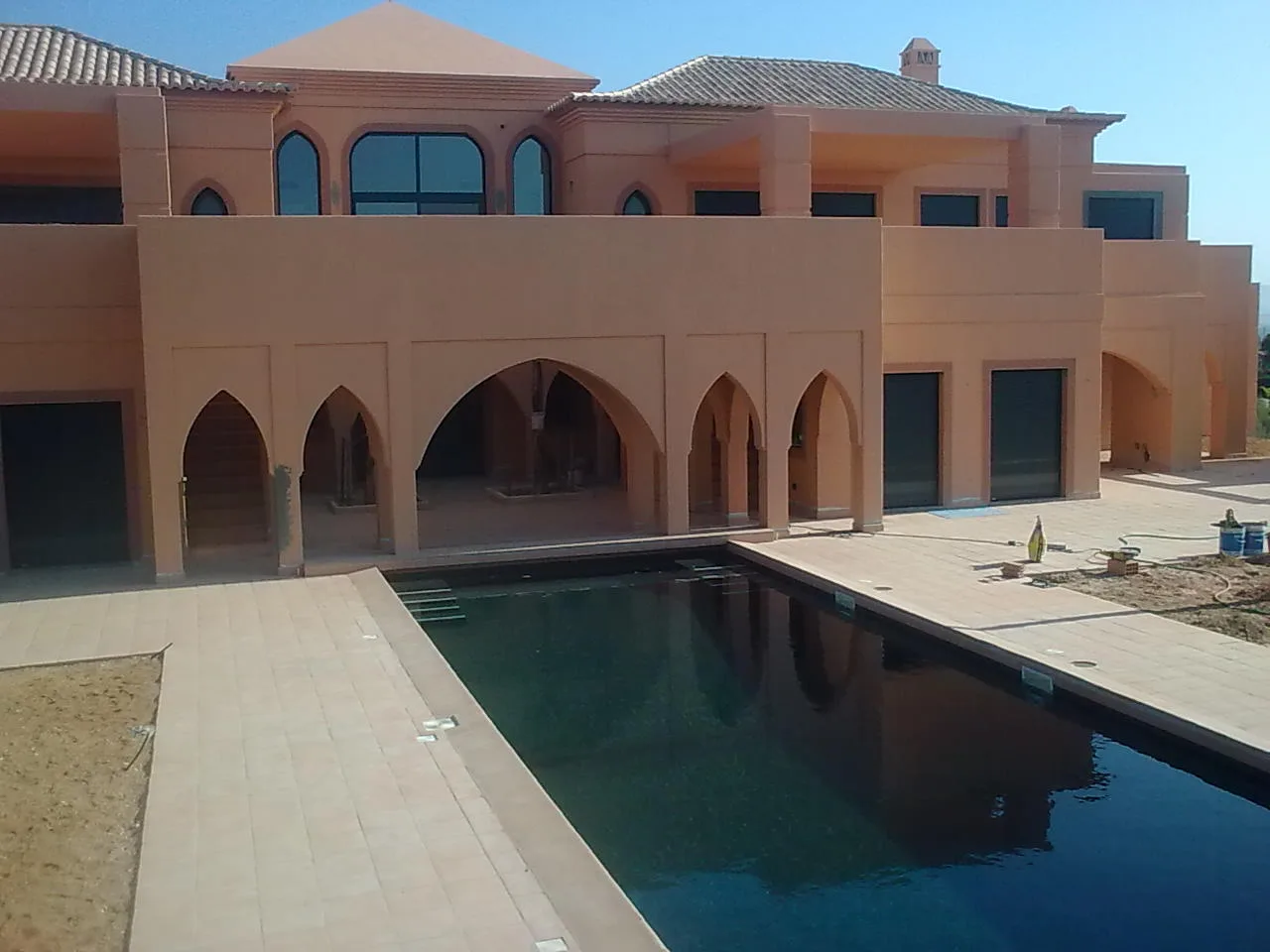 Villa Kasbah's two-storey facade and rectangular pool, Algarve