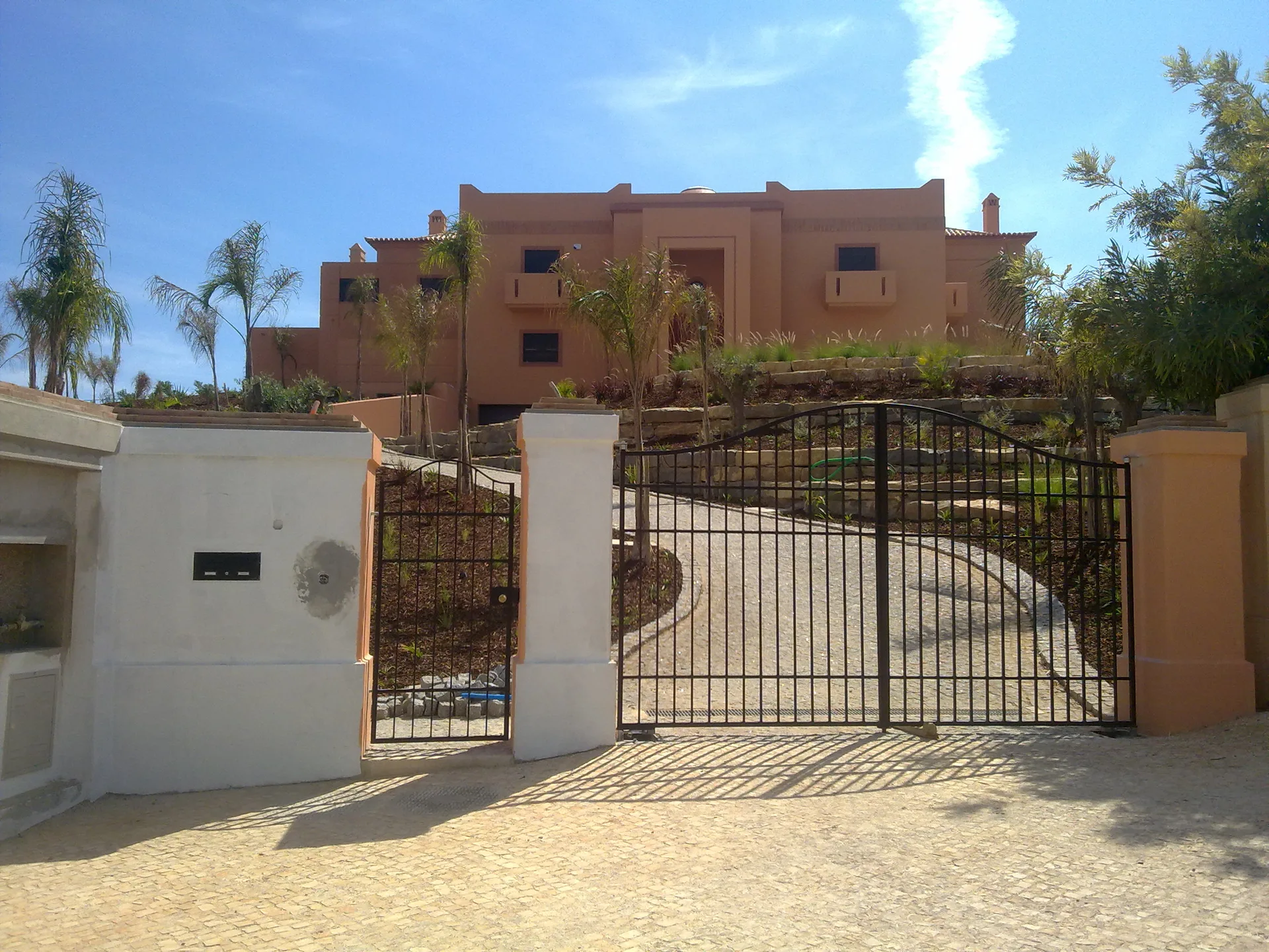 Entrance gates and approach to Villa Kasbah, Algarve