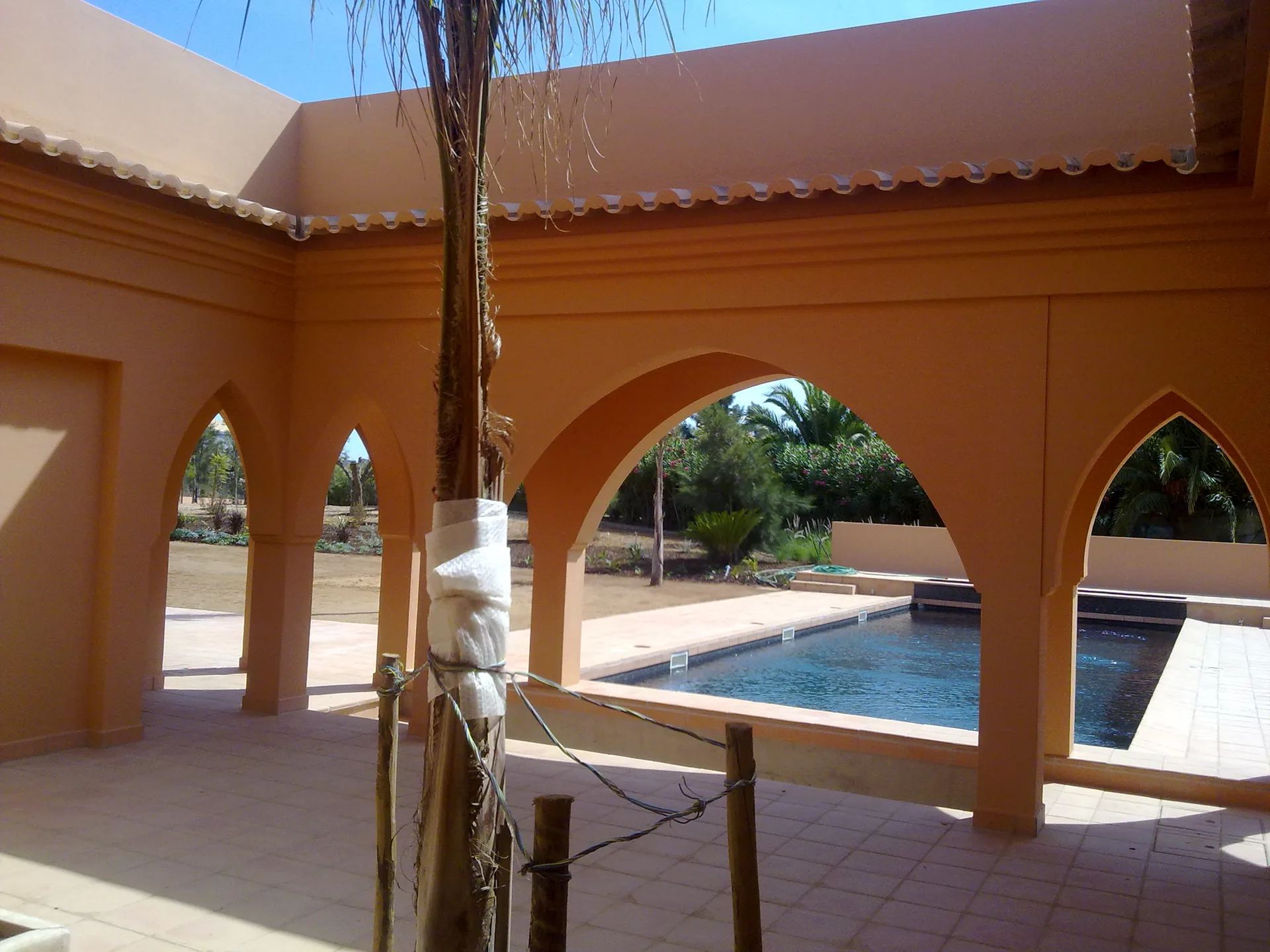 Shaded terrace with pointed arches at Villa Kasbah, Algarve