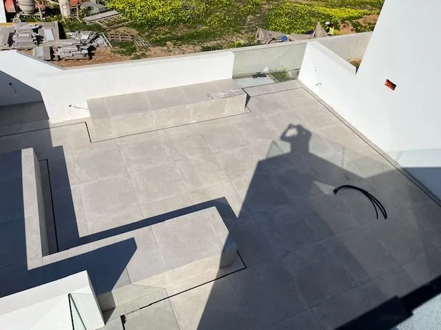 Outdoor terrace and steps with finishing work in progress at Porto de Mós, Lagos