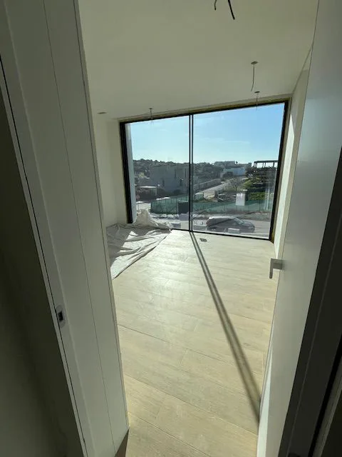 Room with timber-effect flooring and sliding glass doors at Porto de Mós, Lagos