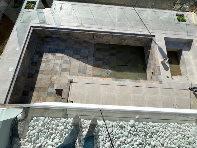 Overhead view of the unfinished tiled swimming pool at Porto de Mós, Lagos
