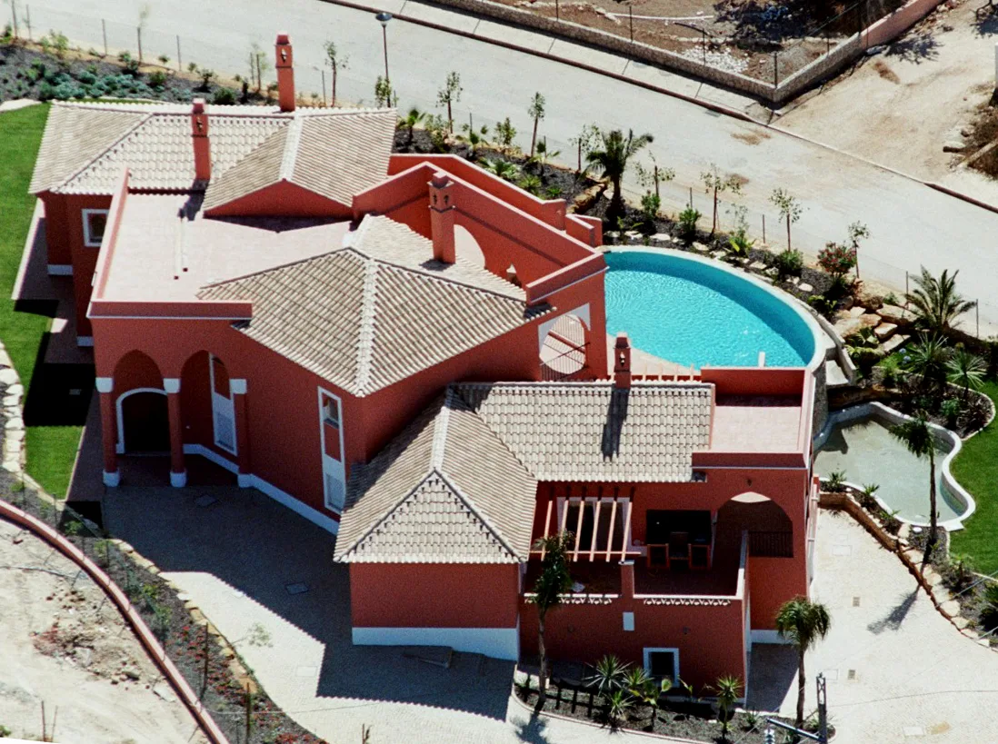 Overhead view of the tiled roof and pool at Quinta do Monte Funchal, Lagos